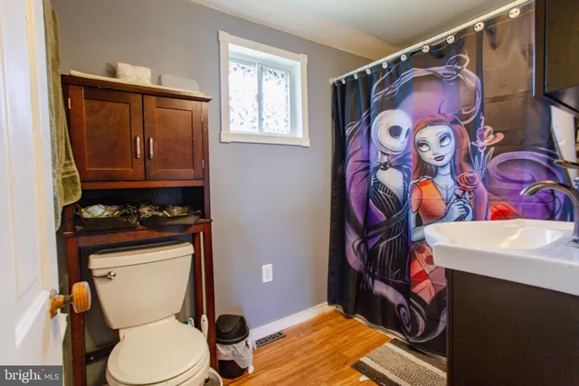 a bathroom with a toilet and a sink