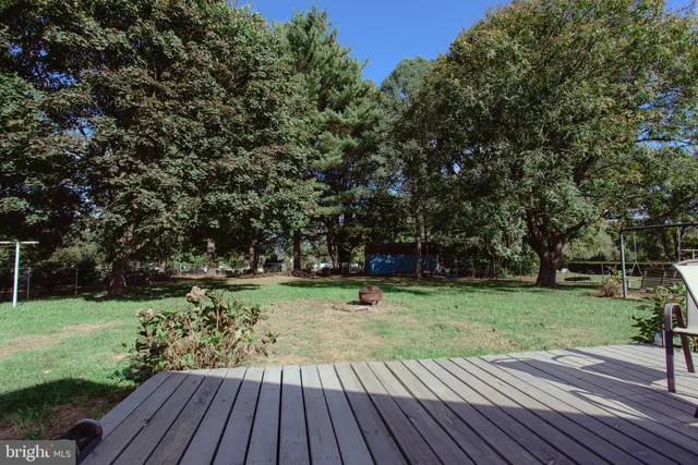 a view of a backyard with wooden floor