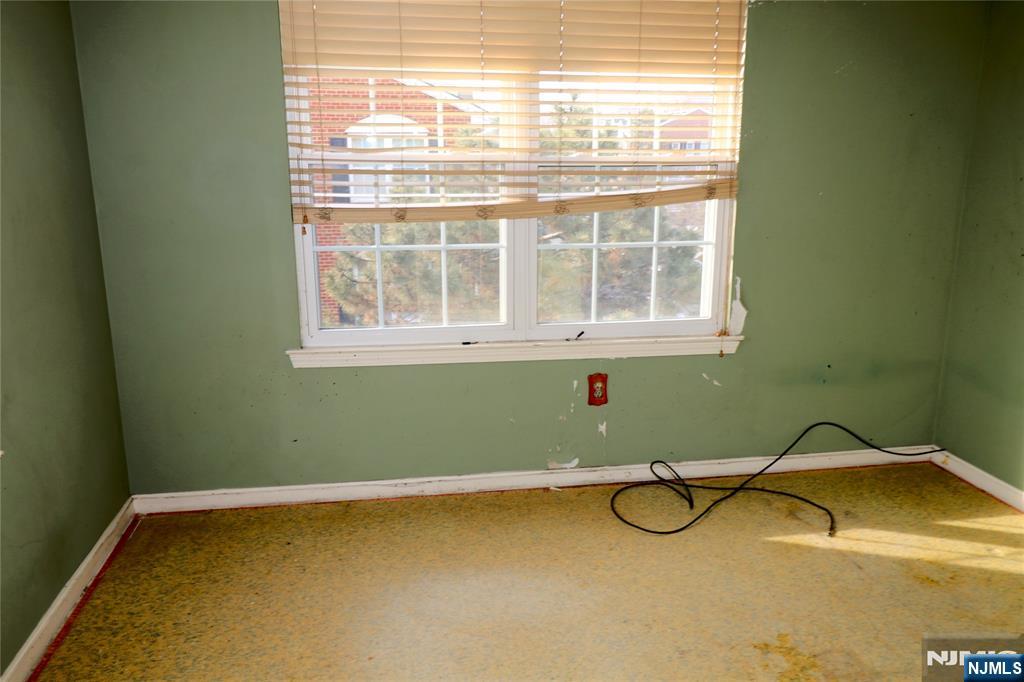 12 Rutgers Drive Newark, NJ 07103 - Photo 18 of 23 a bathroom with a granite countertop window and a sink