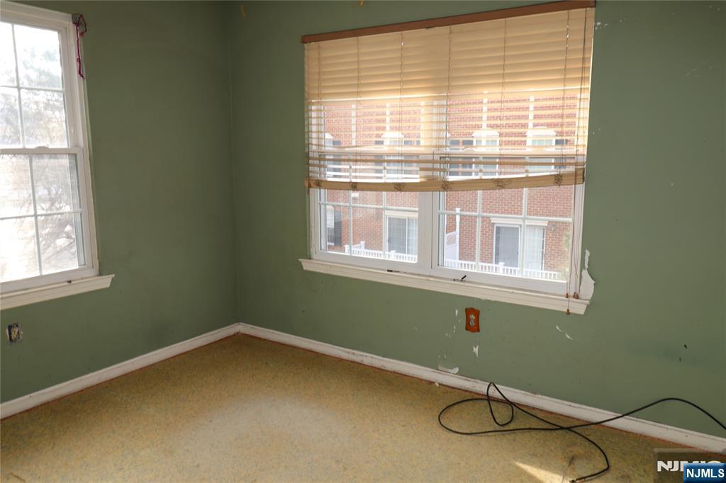 12 Rutgers Drive Newark, NJ 07103 - Photo 19 of 23 a room with a chair and a window