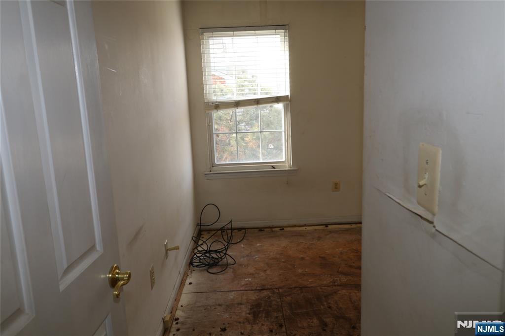 12 Rutgers Drive Newark, NJ 07103 - Photo 21 of 23 a bathroom with a window sink and shower