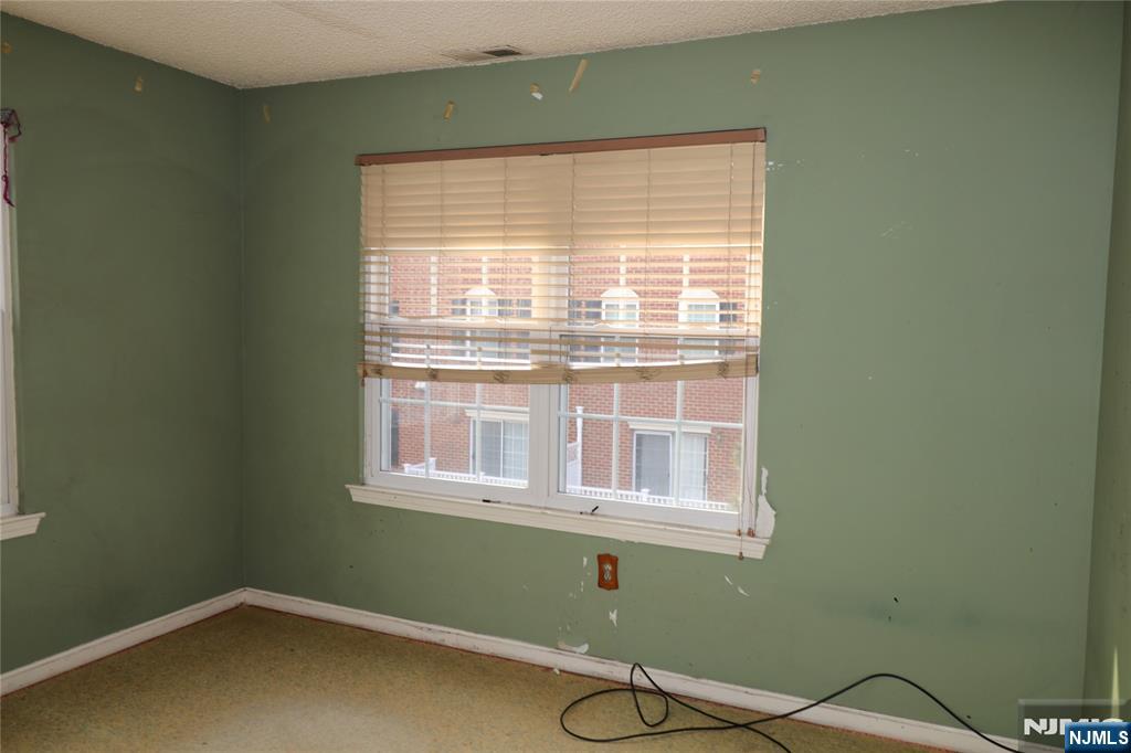12 Rutgers Drive Newark, NJ 07103 - Photo 22 of 23 a view of a room with a fan and a window