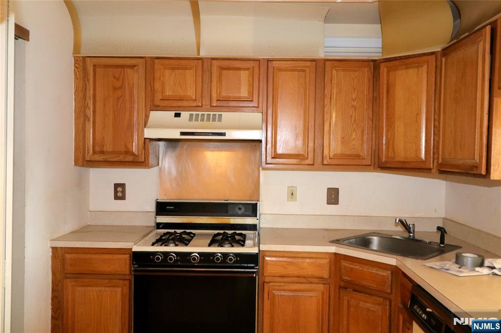 12 Rutgers Drive Newark, NJ 07103 - Photo 7 of 23 a kitchen with stainless steel appliances granite countertop a stove a sink and dishwasher