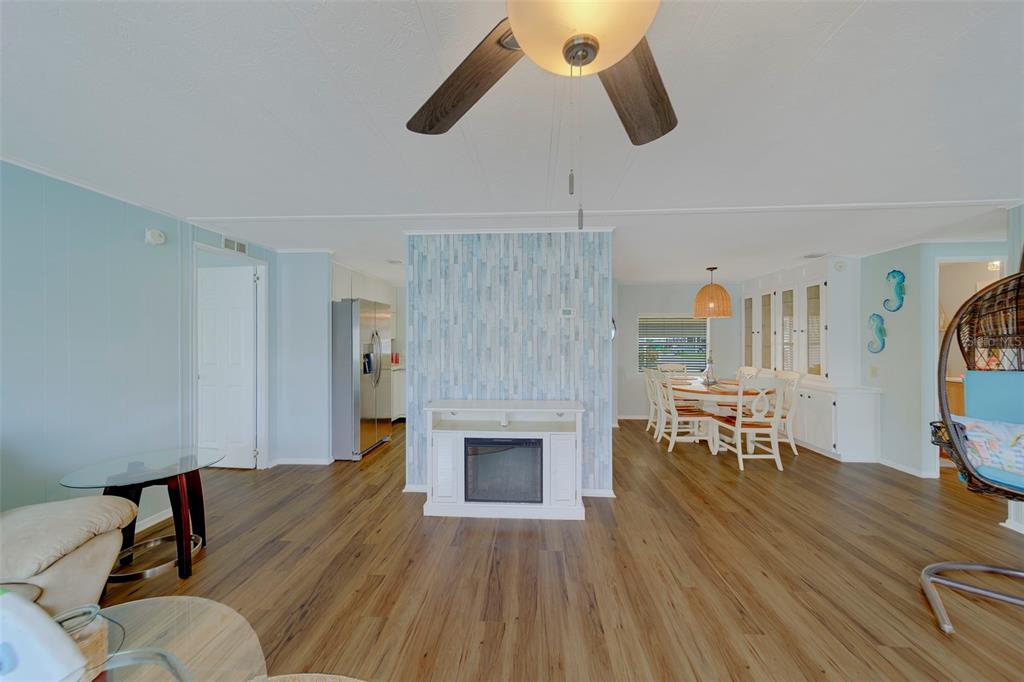 12501 Ulmerton Road, Unit 77 Largo, FL 33774 - Photo 13 of 73 a living room with furniture and a fireplace