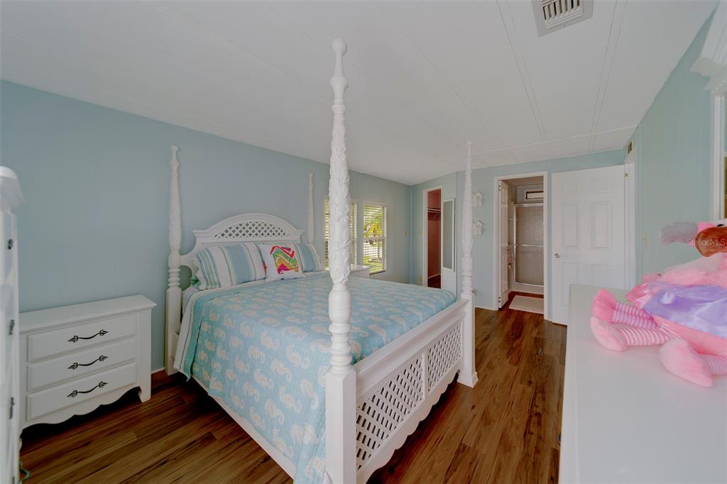 12501 Ulmerton Road, Unit 77 Largo, FL 33774 - Photo 17 of 73 a bedroom with bed and a dresser