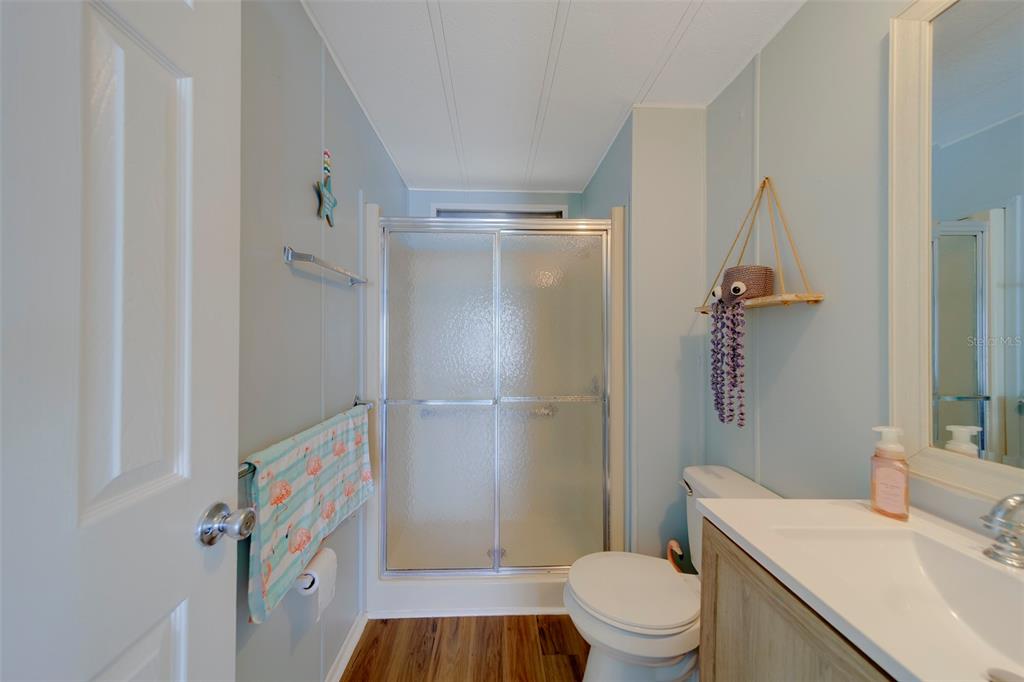 12501 Ulmerton Road, Unit 77 Largo, FL 33774 - Photo 19 of 73 a bathroom with a sink toilet and shower