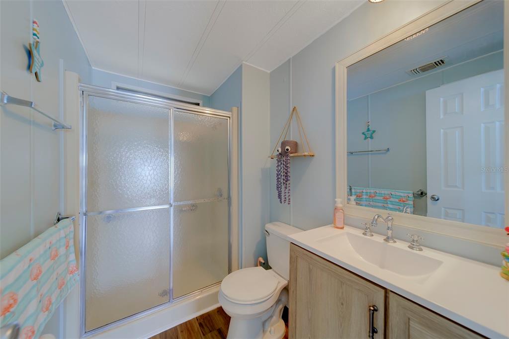 12501 Ulmerton Road, Unit 77 Largo, FL 33774 - Photo 20 of 73 a bathroom with a sink toilet and shower