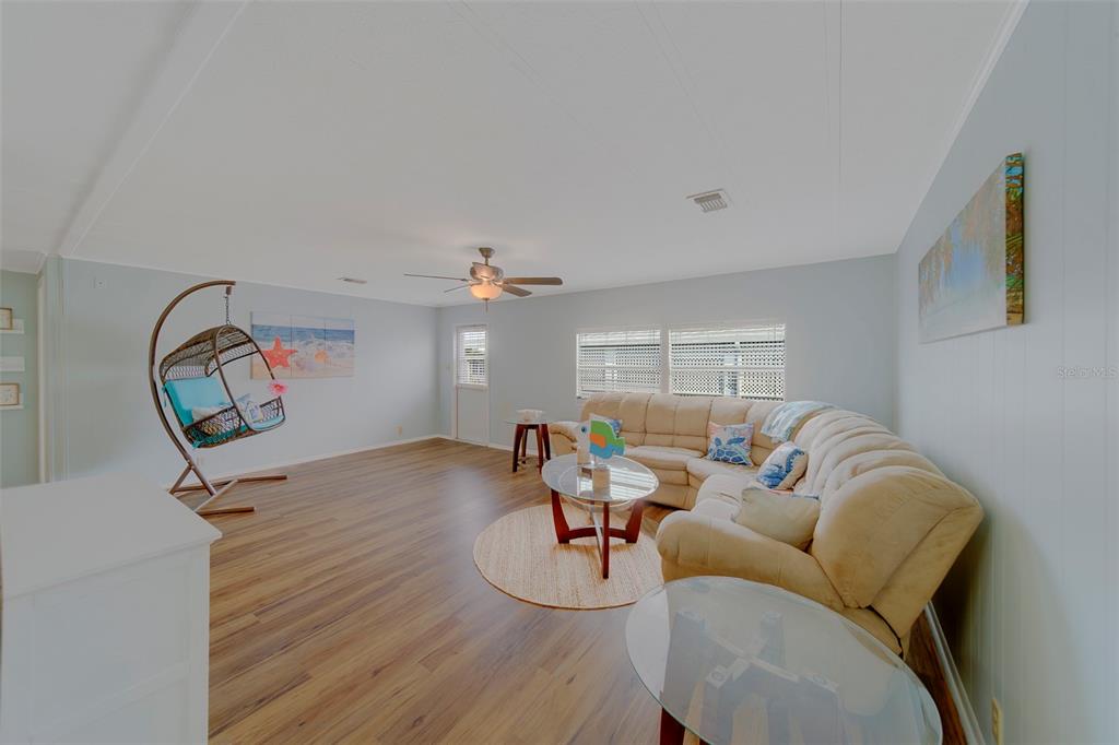 12501 Ulmerton Road, Unit 77 Largo, FL 33774 - Photo 22 of 73 a living room with furniture and a window