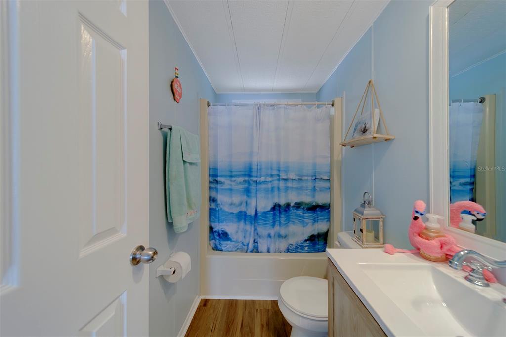 12501 Ulmerton Road, Unit 77 Largo, FL 33774 - Photo 28 of 73 a bathroom with a sink toilet vanity and shower