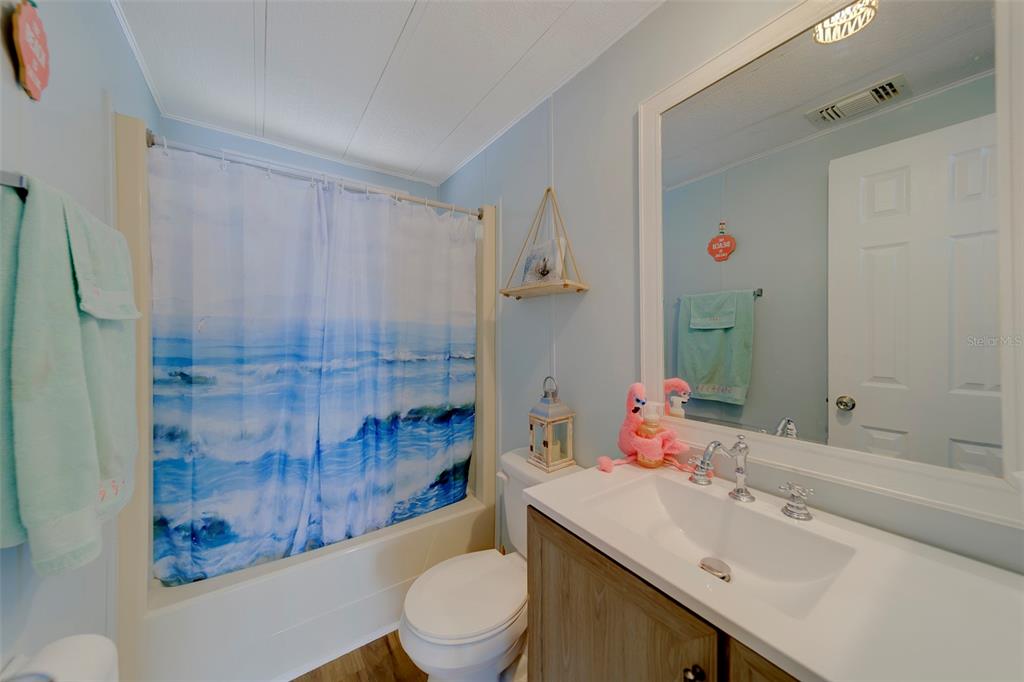 12501 Ulmerton Road, Unit 77 Largo, FL 33774 - Photo 29 of 73 a bathroom with a sink toilet and shower