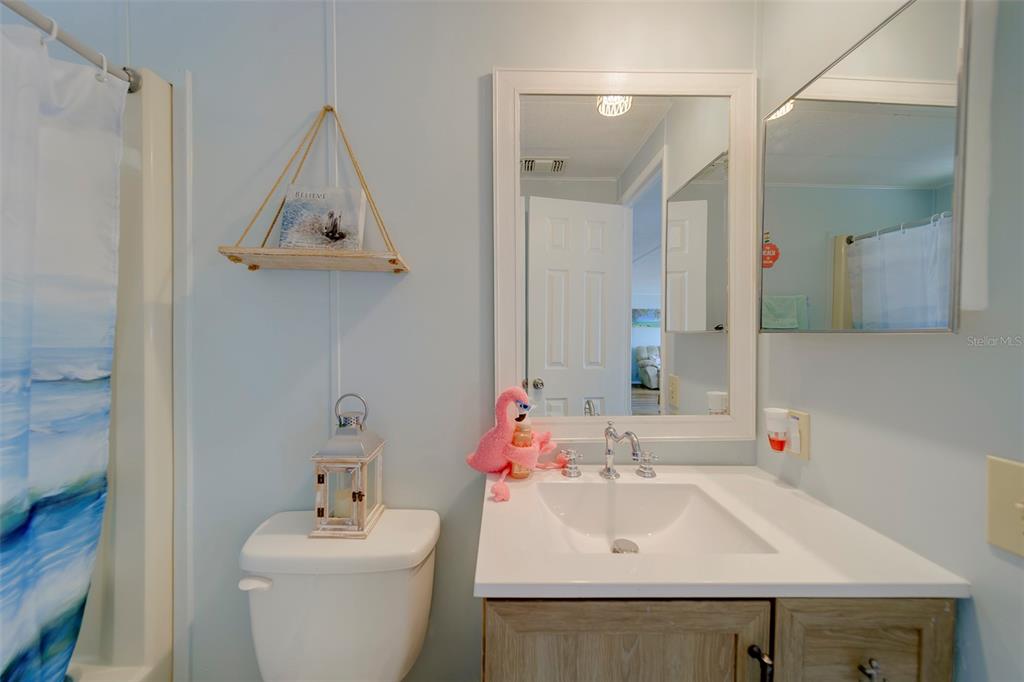 12501 Ulmerton Road, Unit 77 Largo, FL 33774 - Photo 30 of 73 a bathroom with a sink toilet and mirror