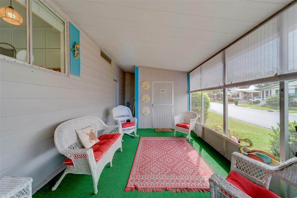 12501 Ulmerton Road, Unit 77 Largo, FL 33774 - Photo 33 of 73 a living room filled with furniture and a rug