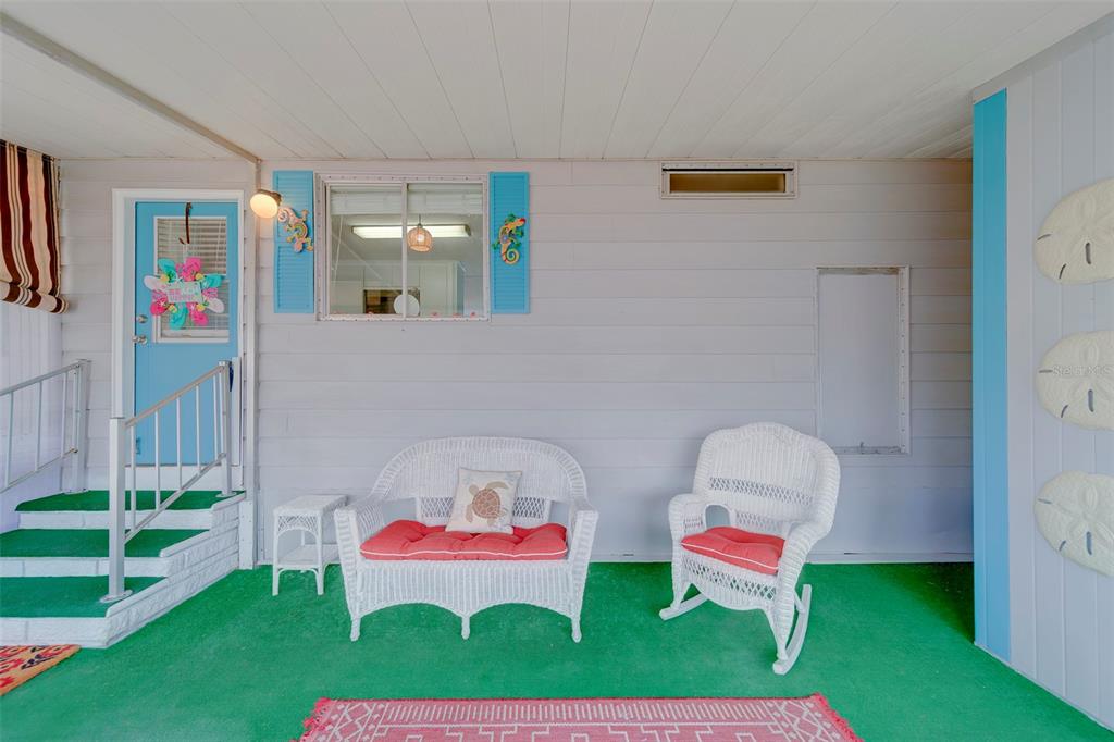 12501 Ulmerton Road, Unit 77 Largo, FL 33774 - Photo 34 of 73 a living room with furniture and a chair