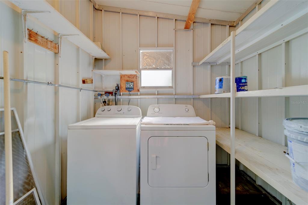 12501 Ulmerton Road, Unit 77 Largo, FL 33774 - Photo 36 of 73 a utility room with dryer and washer