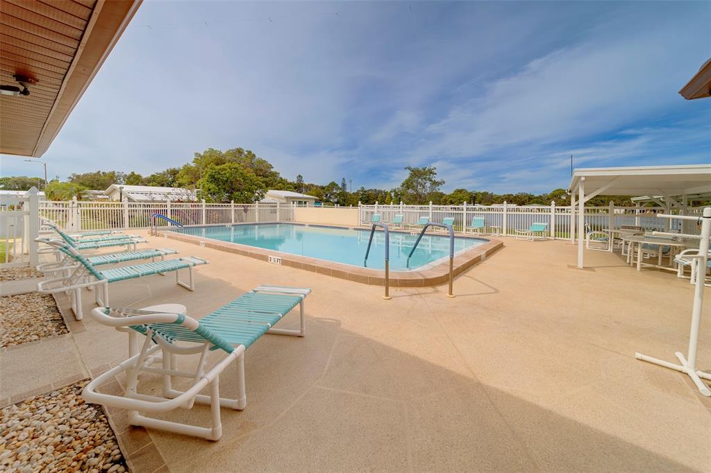 12501 Ulmerton Road, Unit 77 Largo, FL 33774 - Photo 49 of 73 a view of a swimming pool with a patio