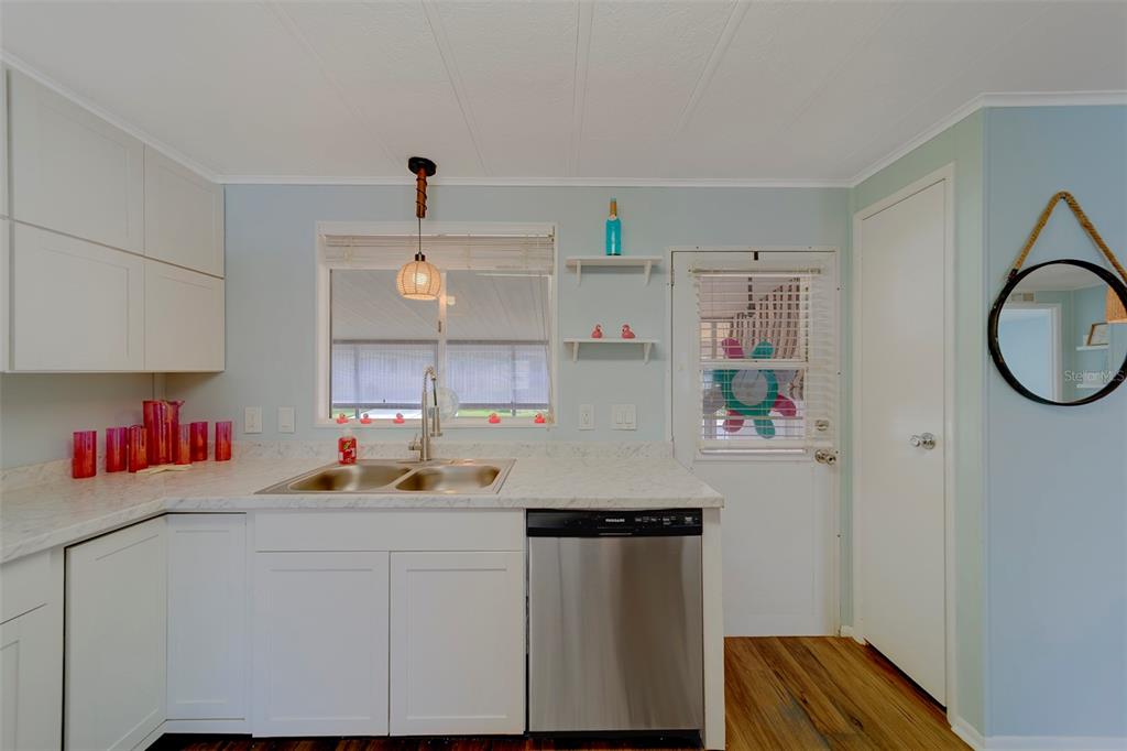 12501 Ulmerton Road, Unit 77 Largo, FL 33774 - Photo 5 of 73 a kitchen with a sink cabinets and window