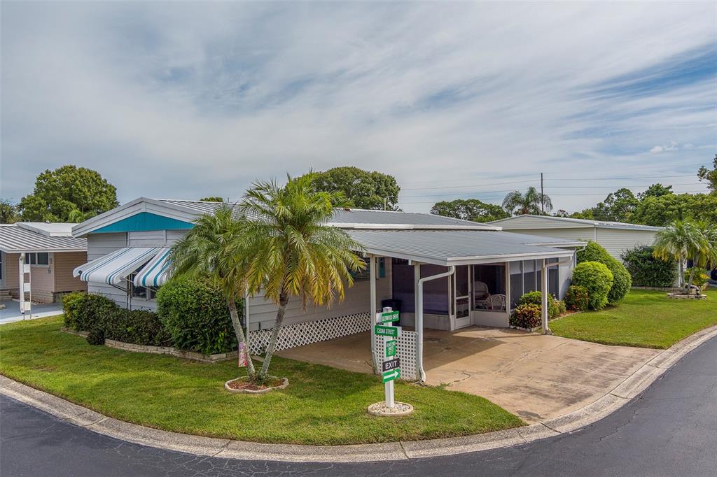 12501 Ulmerton Road, Unit 77 Largo, FL 33774 - Photo 53 of 73 a front view of a house with a yard