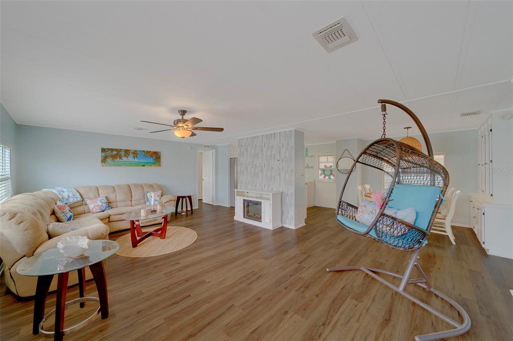12501 Ulmerton Road, Unit 77 Largo, FL 33774 - Photo 10 of 73 a living room with furniture and a wooden floor