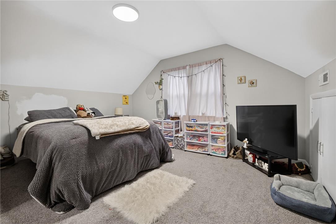 3123 Orefield Road Allentown, PA 18104 - Photo 34 of 39 Sloping ceilings create an intimate atmosphere in this inviting bedroom with soft carpeting.