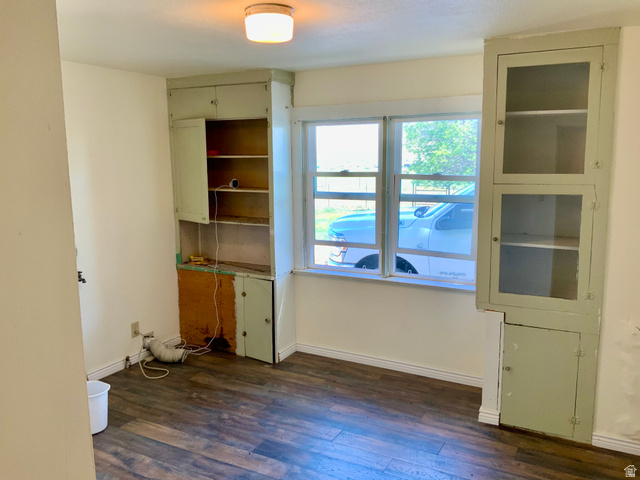 630 North Main Street Monroe, UT 84754 - Photo 17 of 63 Unfurnished room featuring dark wood-style flooring and baseboards