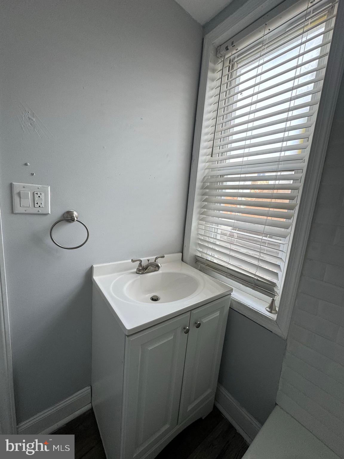 610 9th Street, Unit 2 Chester, PA 19013 - Photo 7 of 8 a bathroom with a sink and a toilet