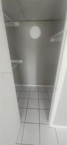 a view of a backyard with a patio table and chairs