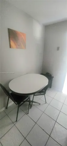 a view of a kitchen with a sink and cabinets