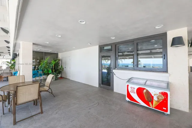 a view of a brick building next to a yard