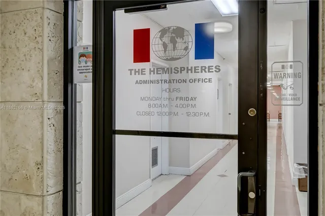 a living room with furniture and a ceiling fan