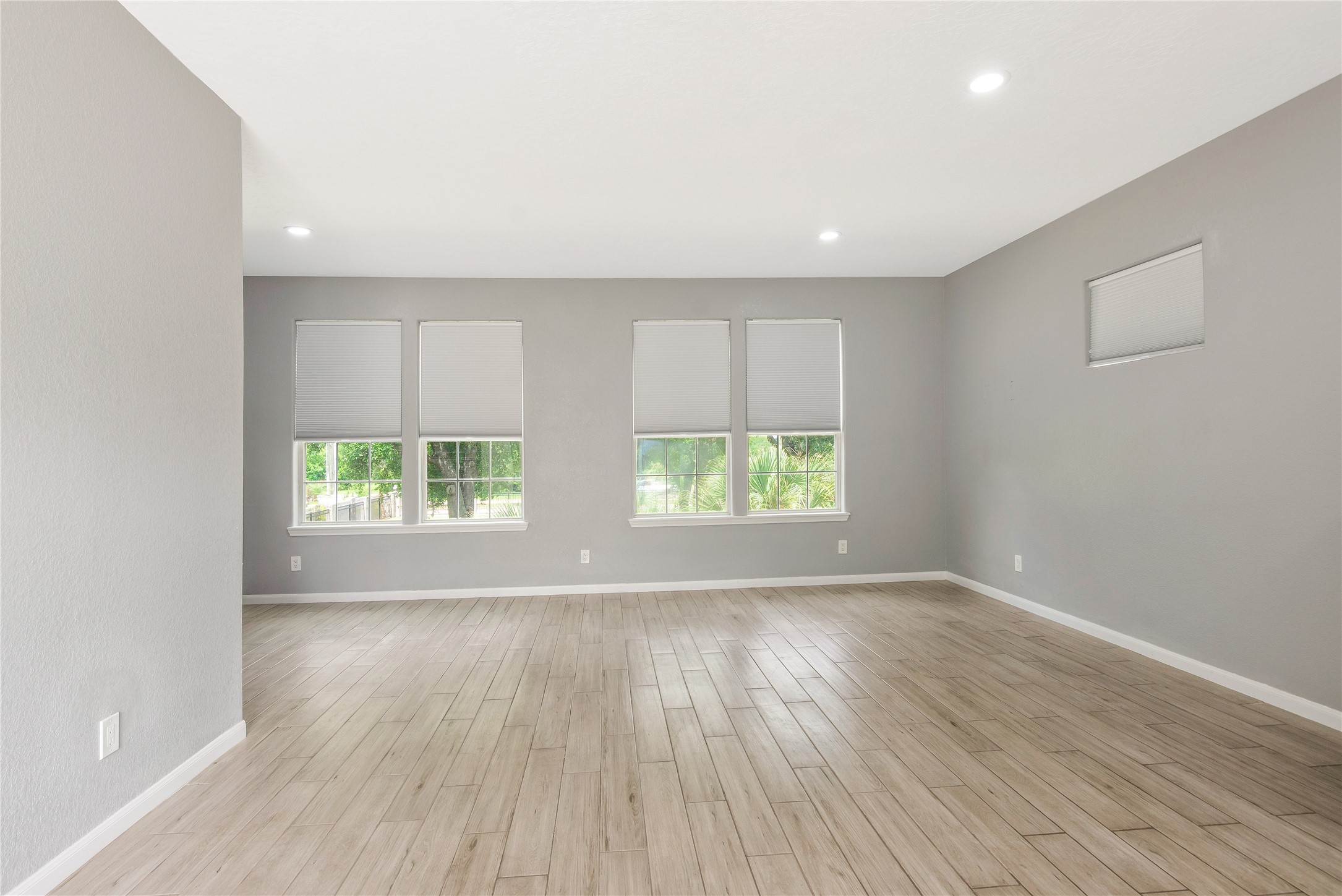 13914 Skinner Road Cypress, TX 77429 - Photo 39 of 50 Casita: Open flex space with recessed lighting and three windows, offering plenty of room to create a private home office, studio, or additional living area.