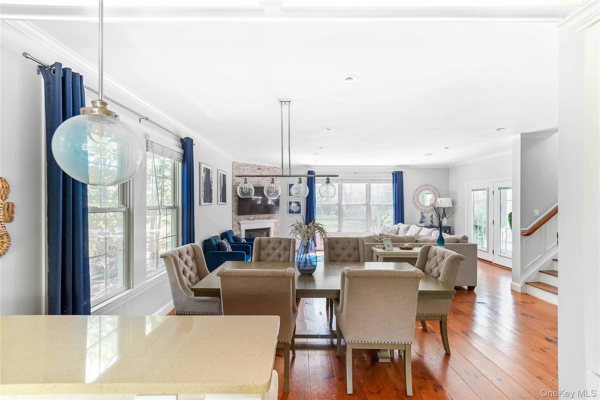 39 Foster Road, Unit A Quogue, NY 11959 - Photo 11 of 21 a living room with furniture fireplace and wooden floor