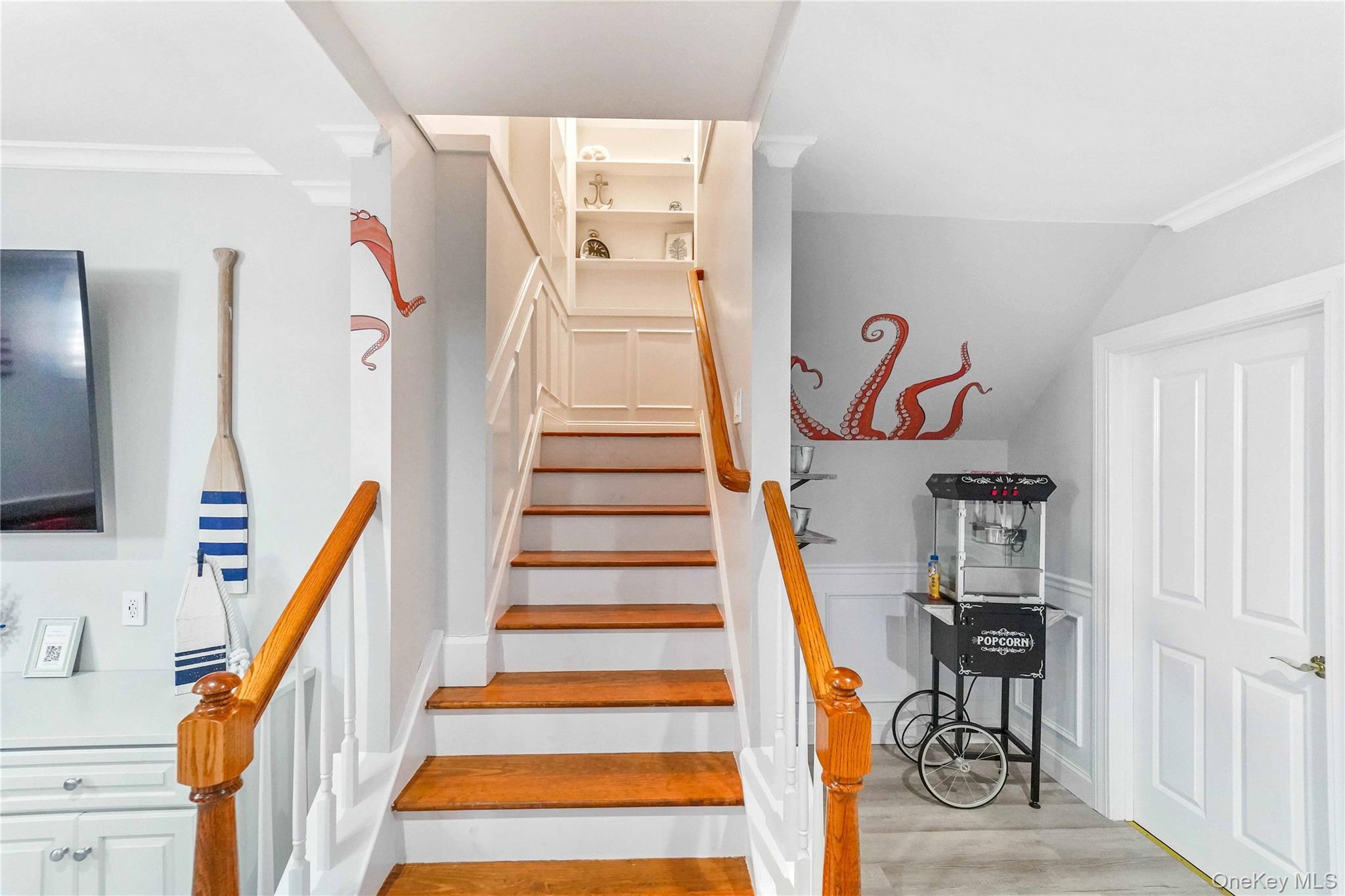 39 Foster Road, Unit A Quogue, NY 11959 - Photo 12 of 21 a view of entryway with wooden floor and stairs