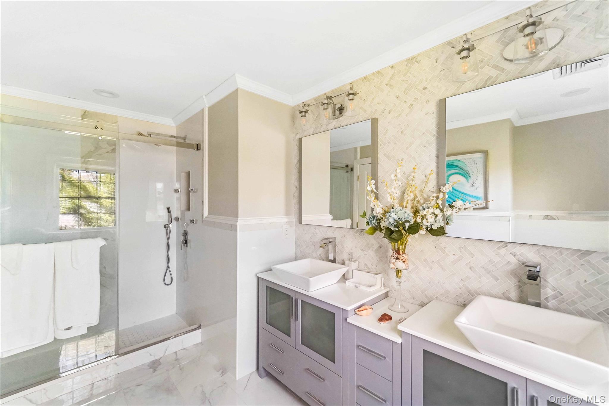 39 Foster Road, Unit A Quogue, NY 11959 - Photo 16 of 21 a bathroom with a double vanity sink mirror and shower
