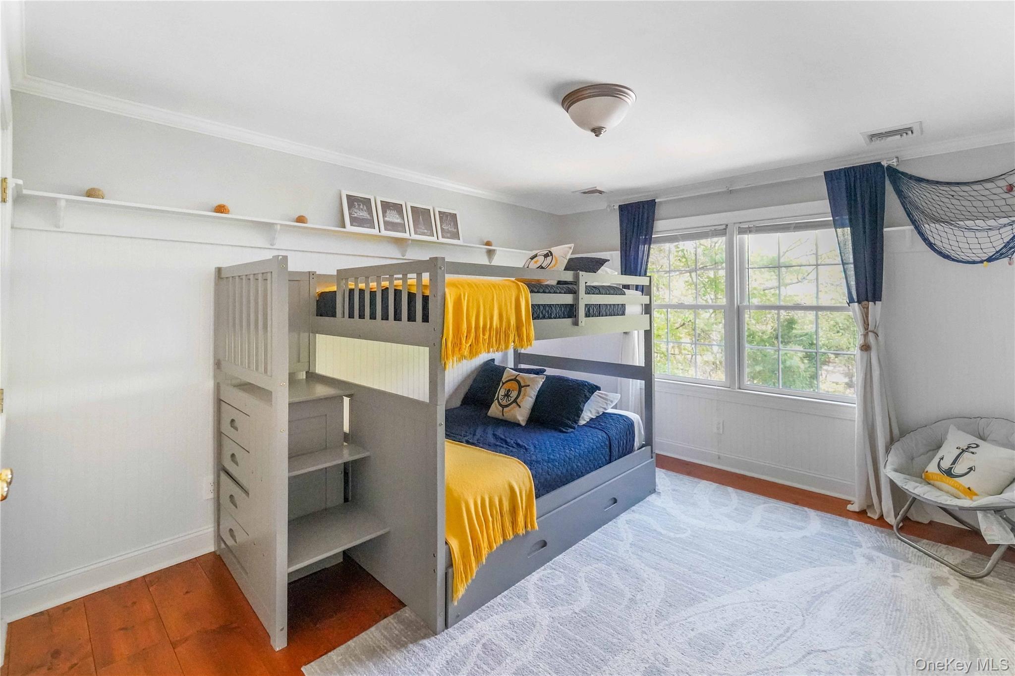 39 Foster Road, Unit A Quogue, NY 11959 - Photo 17 of 21 a bedroom with furniture and a window