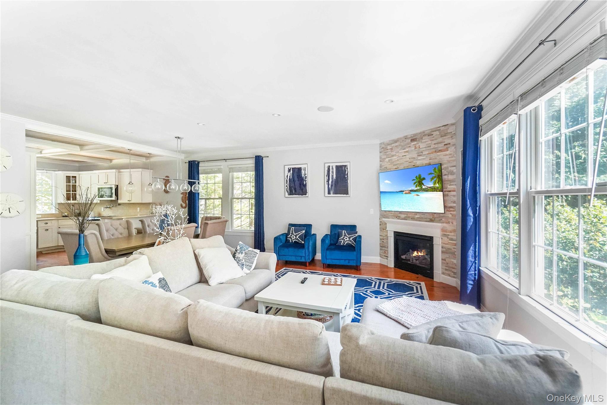 39 Foster Road, Unit A Quogue, NY 11959 - Photo 9 of 21 a living room with furniture and a fireplace