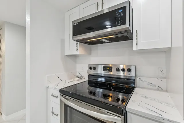 a kitchen with a sink and a refrigerator