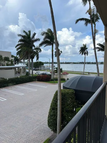 a balcony with chairs and a table