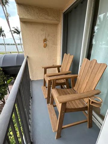 a view of balcony with furniture