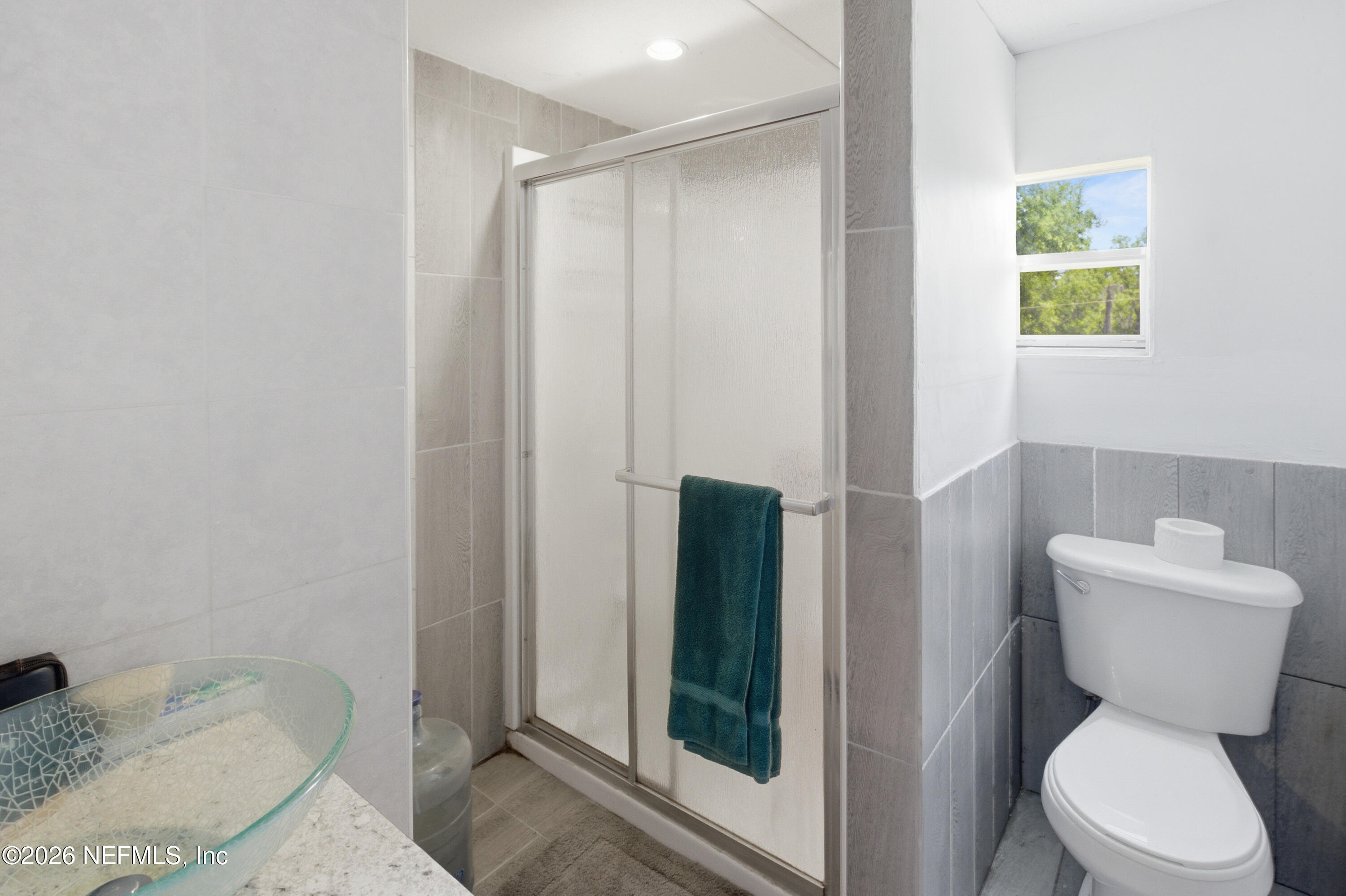 116 London Avenue Interlachen, FL 32148 - Photo 11 of 25 a bathroom with a toilet and a shower