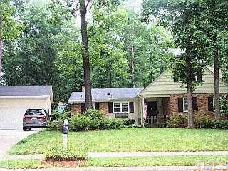 513 Dartmouth Road Raleigh, NC 27609 - Photo 1 of 1 a front view of a house with a garden