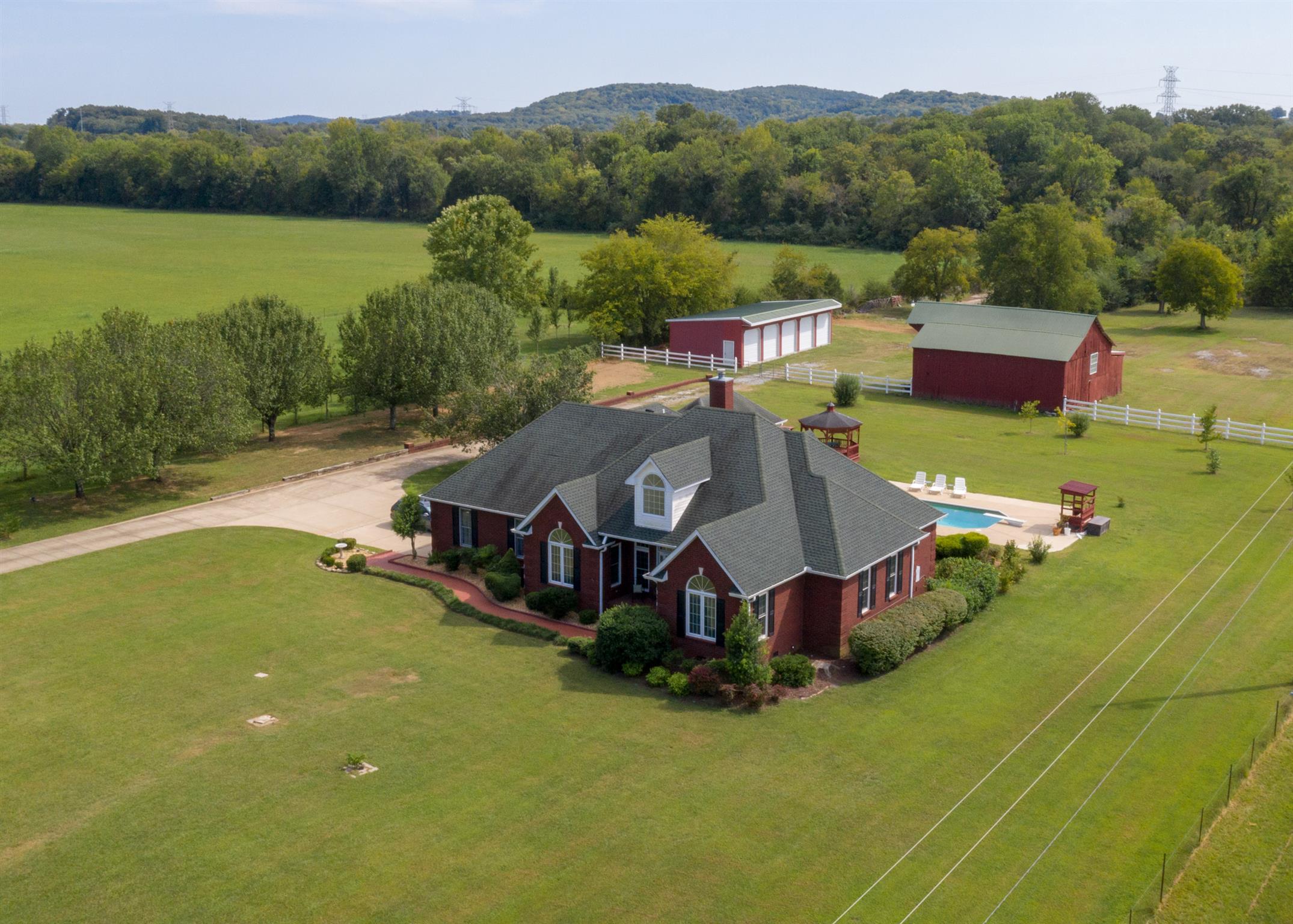 2401 Franklin Road Lebanon, TN 37090 - Photo 2 of 29 an aerial view of a house with pool garden and trees