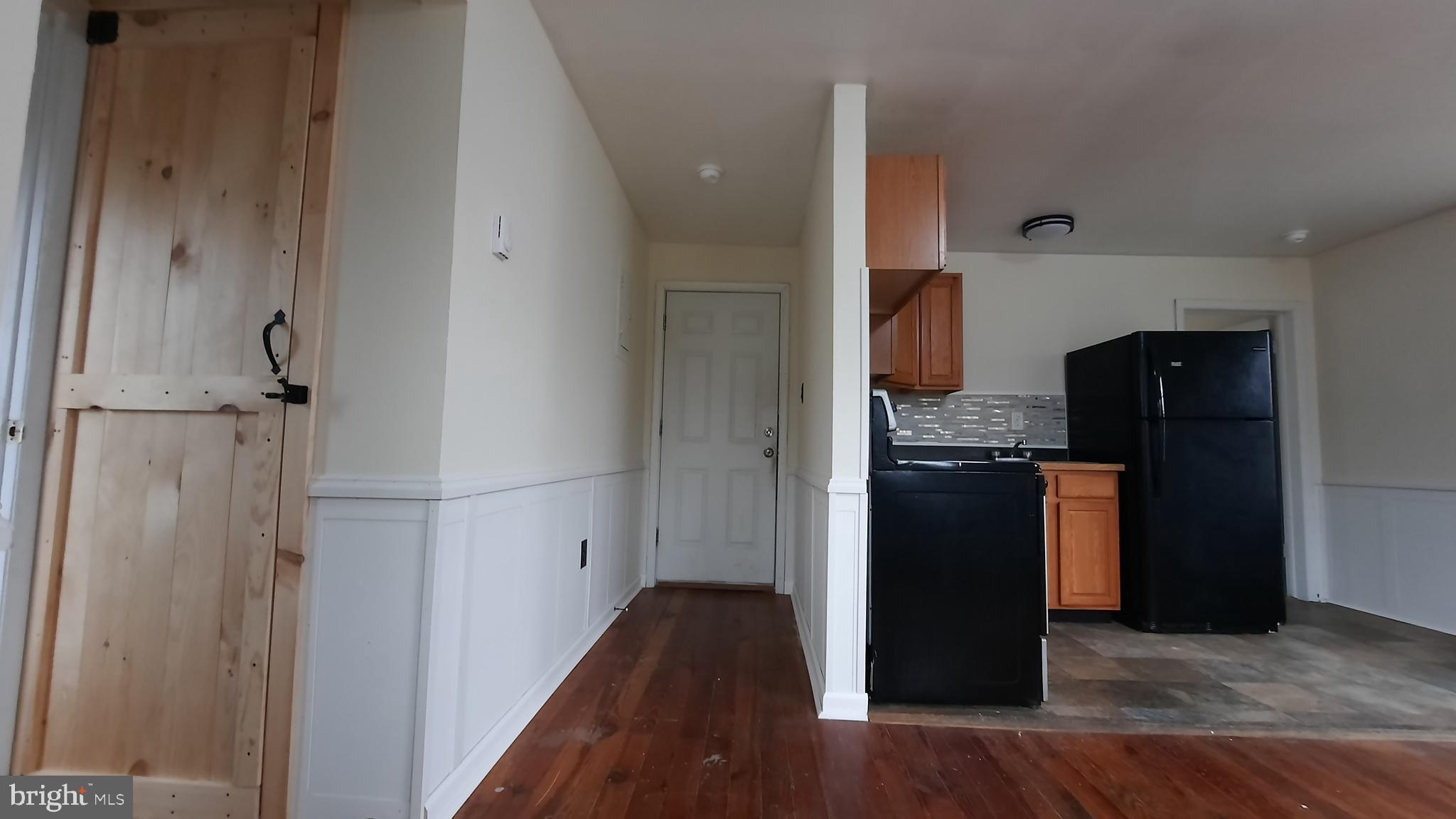 203 Cloud Street, Unit 4 Front Royal, VA 22630 - Photo 8 of 9 a kitchen with granite countertop a refrigerator and a stove