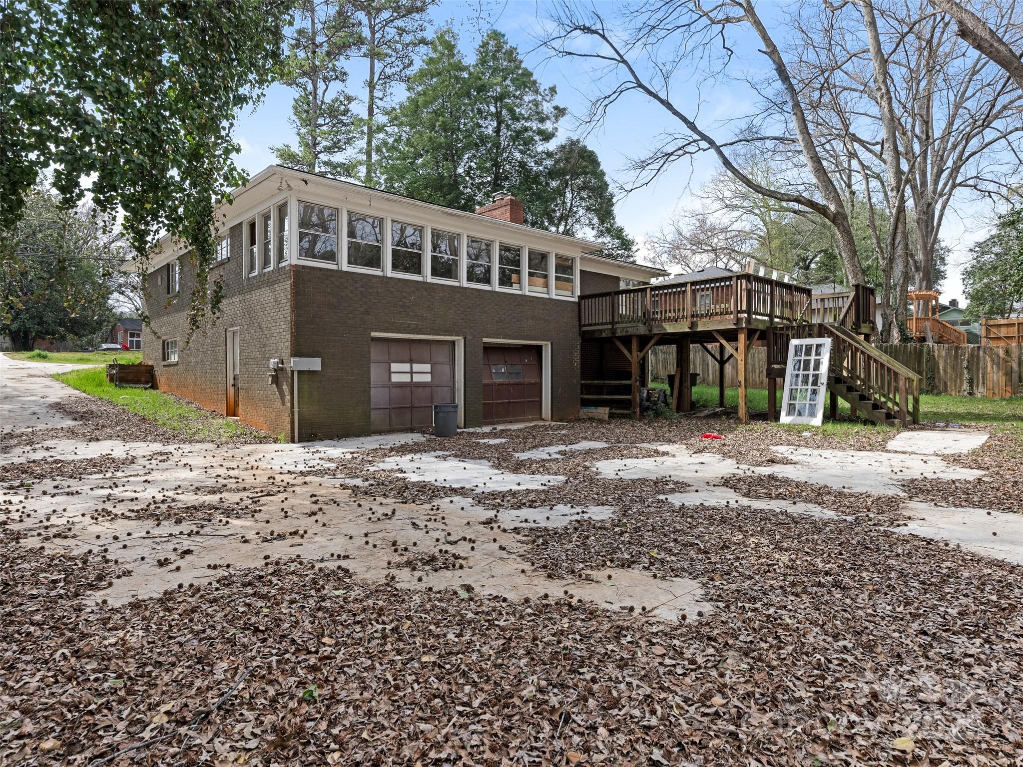 911 East Woodlawn Road Charlotte, NC 28209 - Photo 4 of 5 a front view of a house with a yard