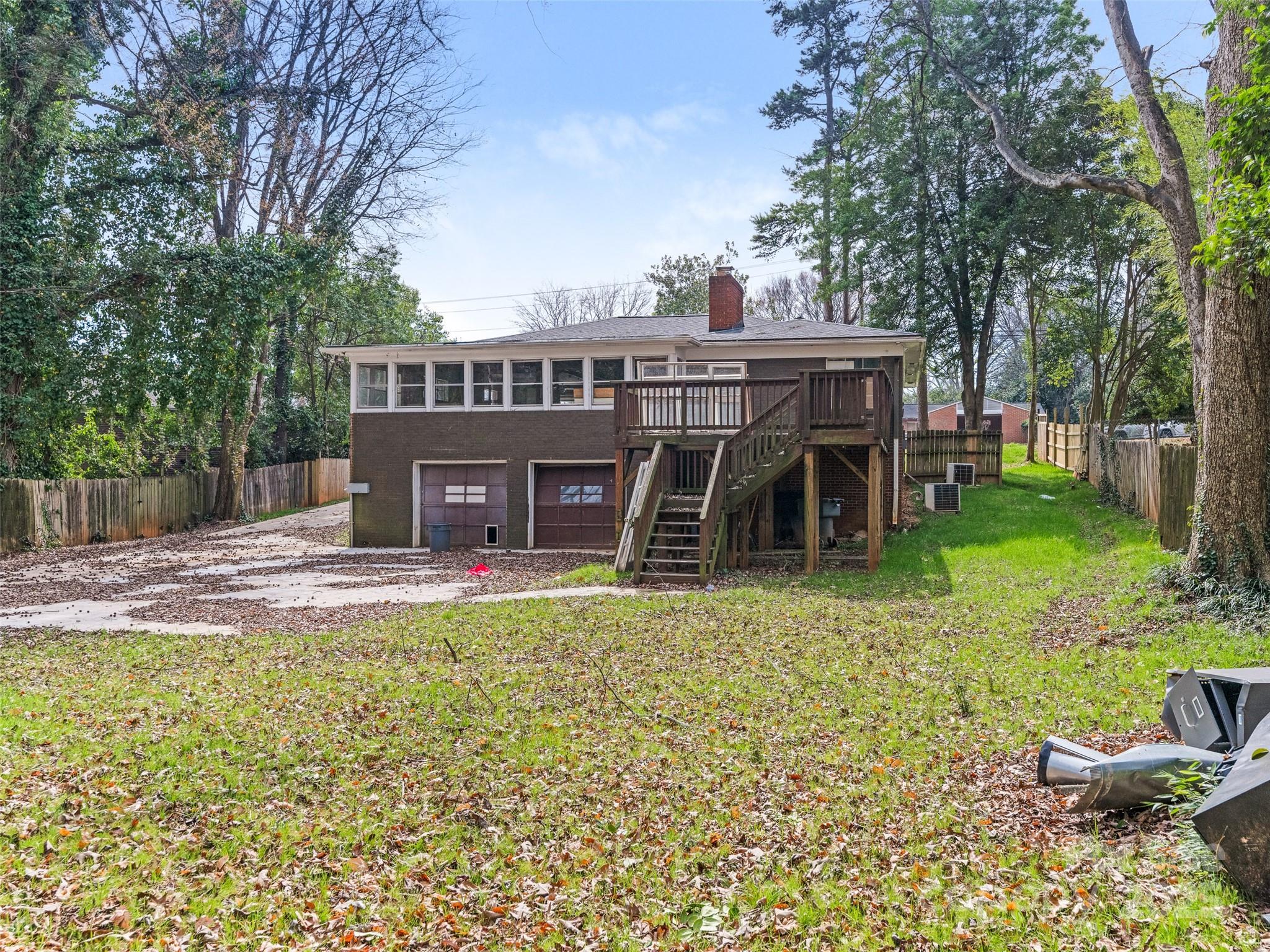 911 East Woodlawn Road Charlotte, NC 28209 - Photo 5 of 5 a view of a house with a yard