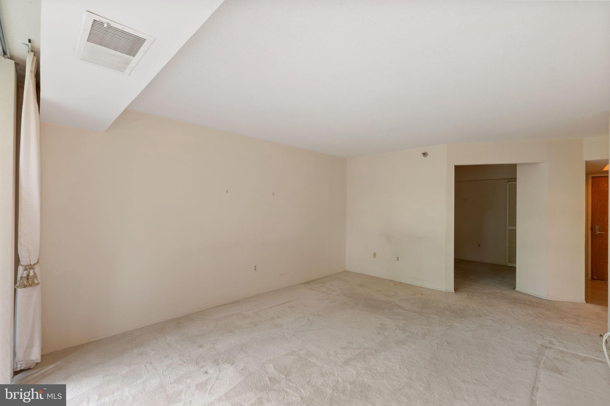 1808 Old Meadow Road, Unit 717 McLean, VA 22102 - Photo 12 of 48 Living room into den