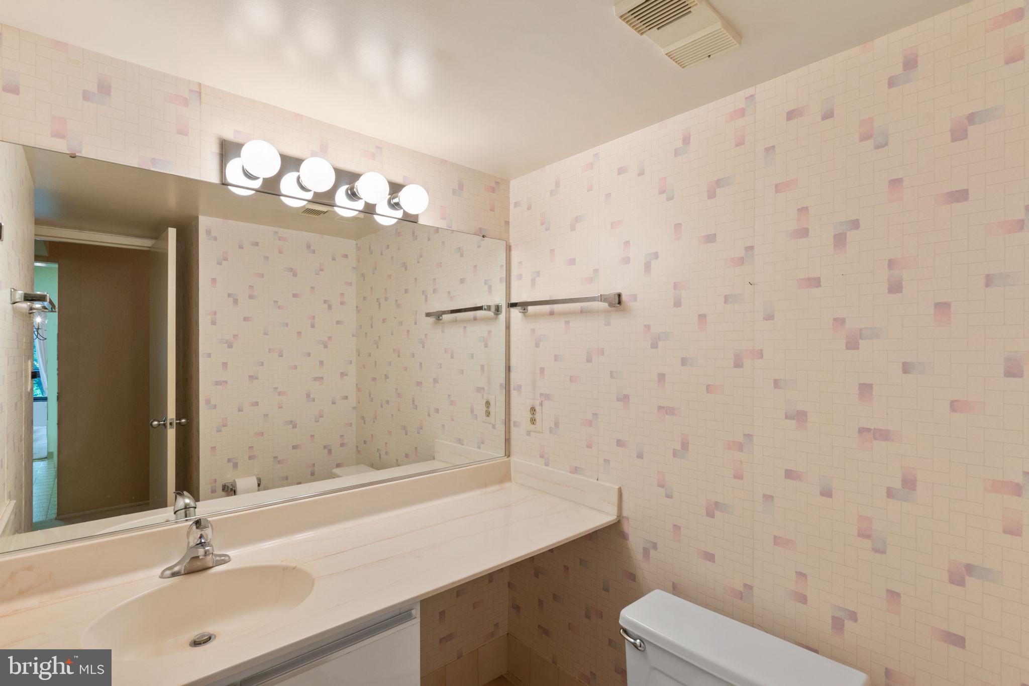 1808 Old Meadow Road, Unit 717 McLean, VA 22102 - Photo 22 of 48 1/2 bath off hallway