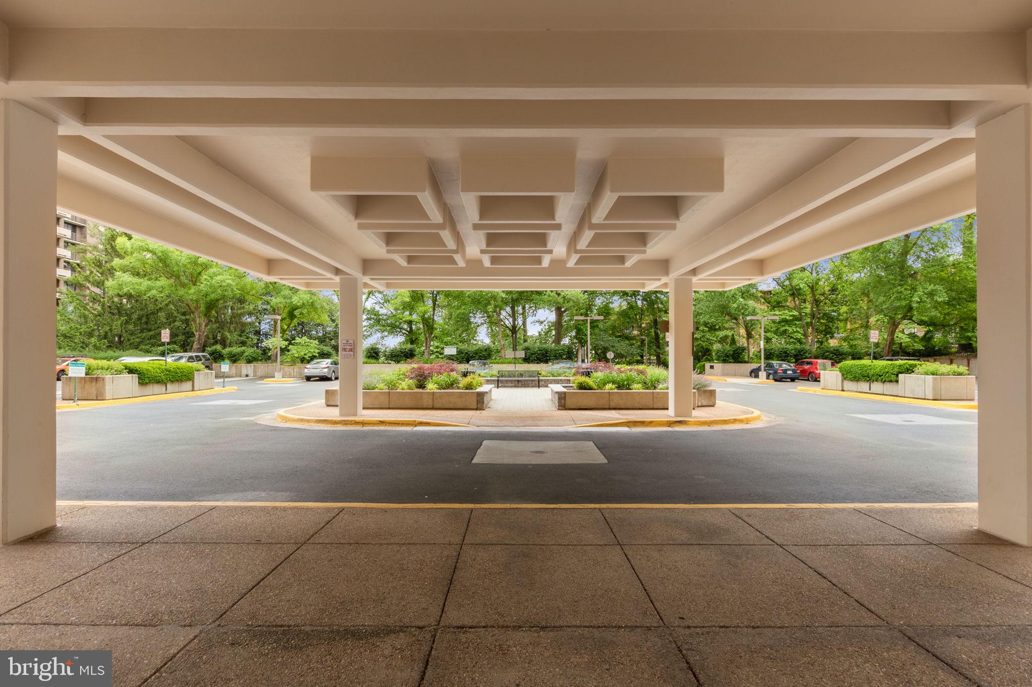 1808 Old Meadow Road, Unit 717 McLean, VA 22102 - Photo 4 of 48 Covered drop off area outside building entrance