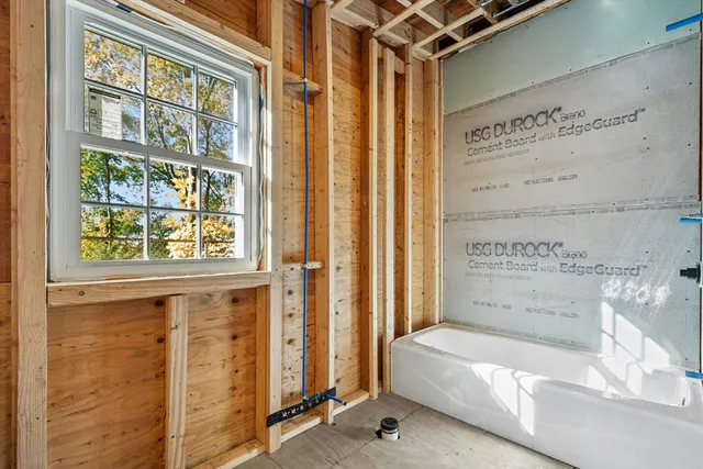 a bathroom with a tub and shower