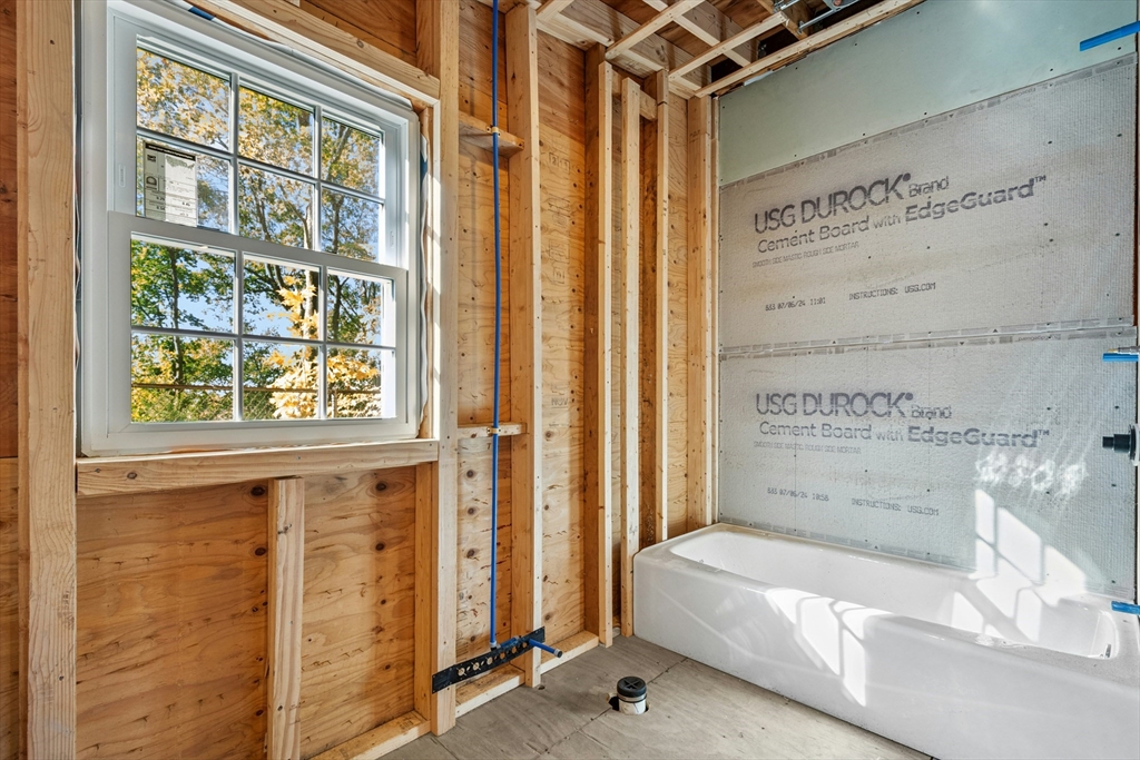 8 Pine Street, Unit 4 Boston, MA 02136 - Photo 6 of 12 a bathroom with a tub and shower
