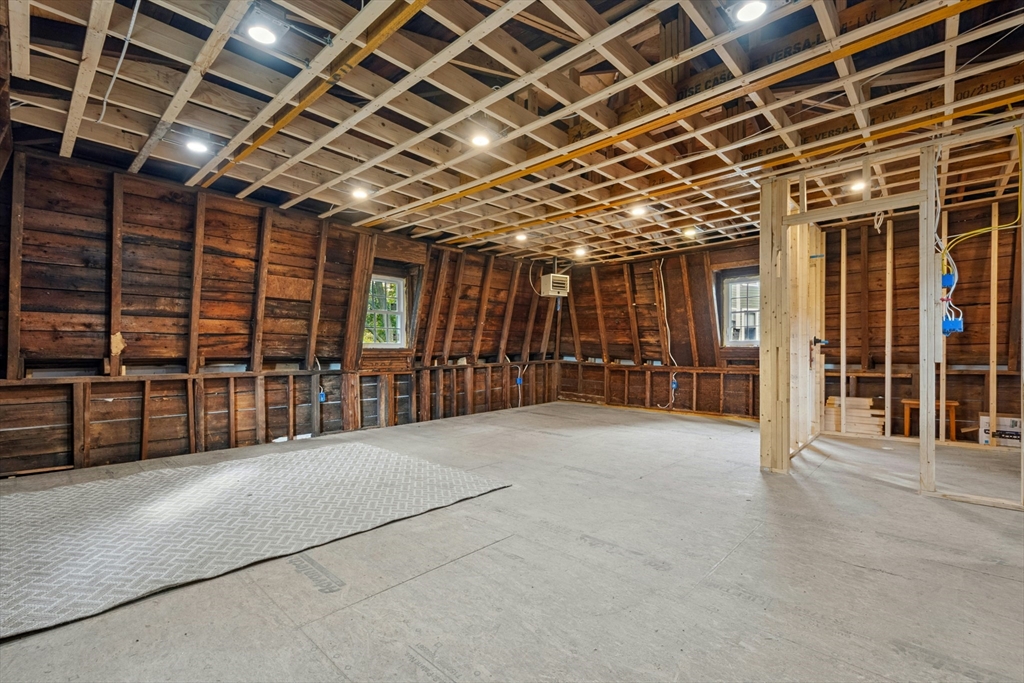 8 Pine Street, Unit 4 Boston, MA 02136 - Photo 7 of 12 a view of an empty room with wooden floor